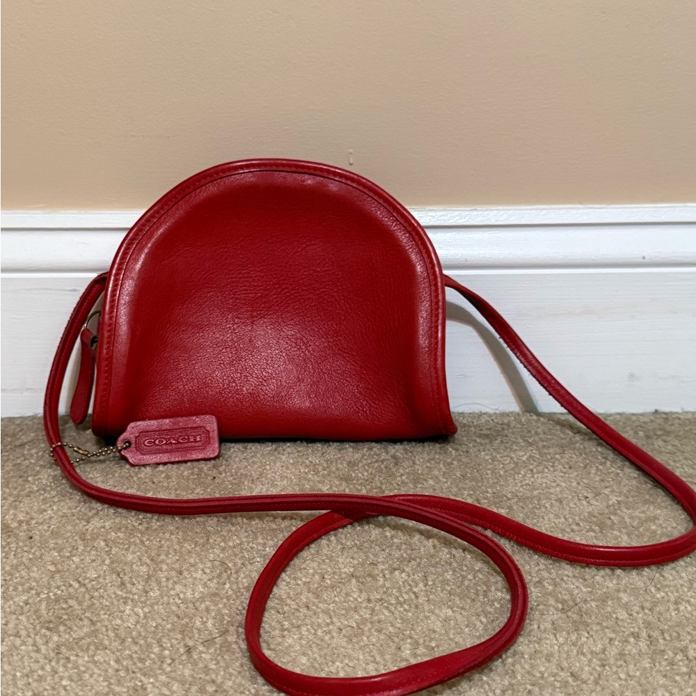 vintage Coach Kimball half-moon crossbody bag made from red leather.